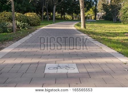 close-up of Road sign on the cycleway, bikeway for cyclists only. Bike lane in the Turia River gardens in Valencia Spain