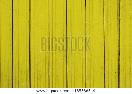 Texture of old wooden planks with peeling color paint