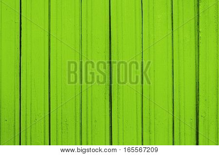 Texture of old wooden planks with peeling color paint