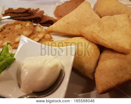 Fried dumpling with vegetarian salami and mayonnaise