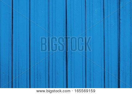 Texture of old wooden planks with peeling color paint