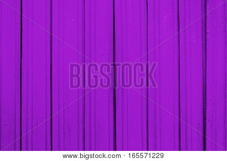 Texture of old wooden planks with peeling color paint
