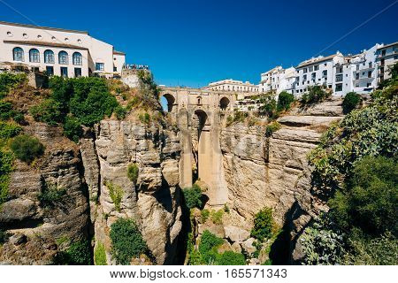 The Puente Nuevo, New Bridge, is newest and largest of three bridges that span the 120-metre , 390 ft, -deep chasm that carries the Guadalevin River and divides city of Ronda, Province Of Malaga, Spain