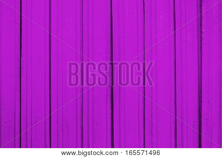 Texture of old wooden planks with peeling color paint
