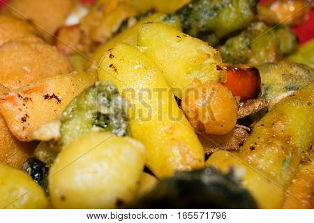 Mix of fried vegetables, potatoes and mozzarella cheese
