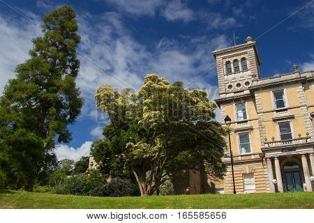 EXETER DEVON UK - July 11 2016: Old campus of the University of Exeter. Reed Hall. Many of green trees. Summer. Day.