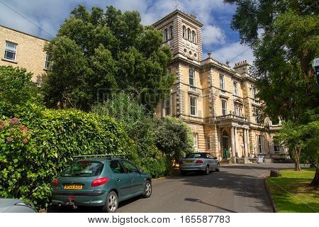 EXETER DEVON UK - July 11 2016: Old campus of the University of Exeter. Reed Hall. Many of green trees. Summer. Day.