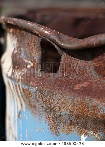 A close up of an empty and discarded oil drum that is rusting just north of Redmond in Deschutes County in Central Oregon on a spring day.