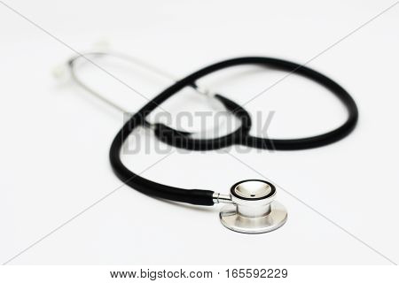 stethoscope on a white surface and background