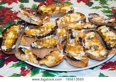 toasted bread smeared with butter and jam
