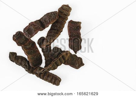 Dried Shikakai pods or soap bobs (Acacia Concinna) on white