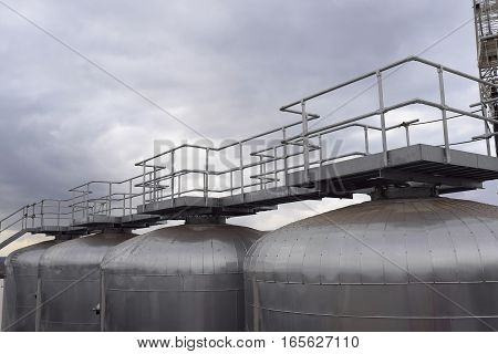Fermentation Tank At A Brewery With Walkway And Platform