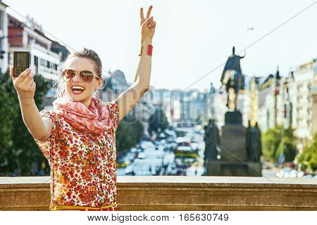 Tourist Woman With Digital Camera Taking Selfie In Prague