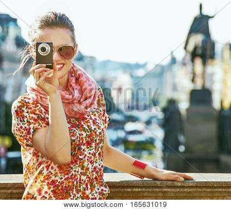 Tourist Woman With Digital Camera Taking Photo In Prague