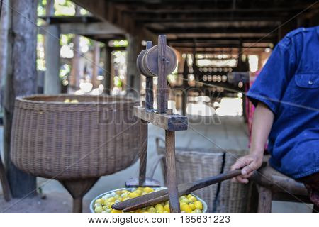 Woman make the silk yarn from cocoons