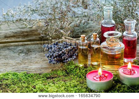 Bunch Of Dry Lavender, Candles And Bottles Of Scented Oil.
