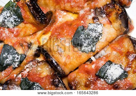 Rolled slices of eggplant, stuffed with ham and cheese, served with tomato basil and grated Parmesan cheese and baked