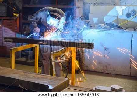 Working Welder Welds Parts Factory