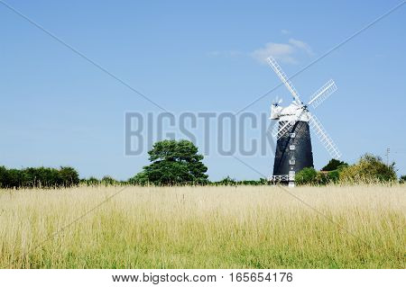 BURNHAM OVERY STAITHE, UK - AUGUST 30, 2016: The tower Windmill, built in 1816 was used as a corn ill until damaged by a storm, Norfolk, UK