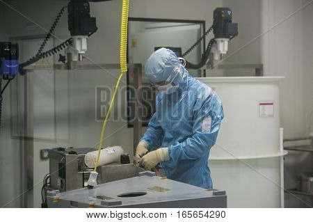 ST. PETERSBURG, RUSSIA - NOVEMBER 16, 2016: Staff working in clean area in the production site of the biotechnology company BIOCAD.  Full-cycle drug development and manufacturing companies