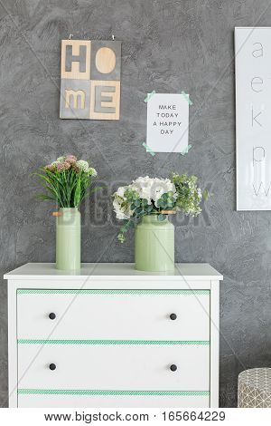 Chest Of Drawers Against Grey Wall