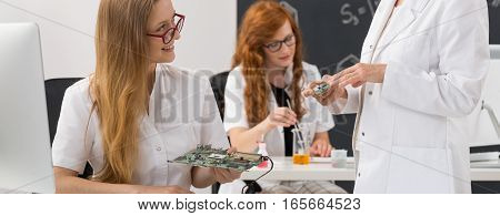 Electrical Engineers Studying Computer Components