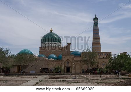 View of Pahlavon Mahmud Mausoleum and Islam Khodja minaret Khiva Uzbekistan.