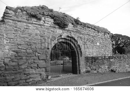 An exterior view of the ruins of an abbey in Newburgh