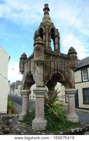 A view of an old stone fountain in Newburgh