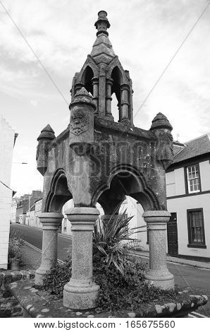 A view of an old stone fountain in Newburgh