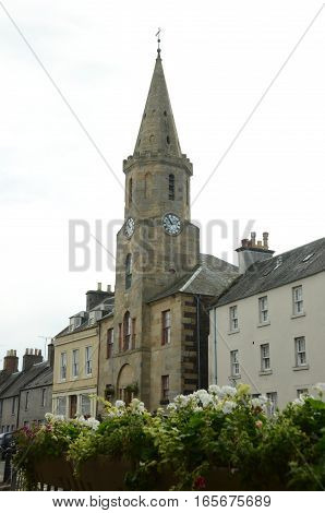 A view of a clock tower building in Newburgh