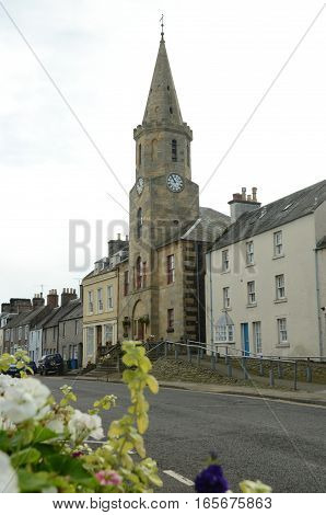A view of a clock tower building in Newburgh