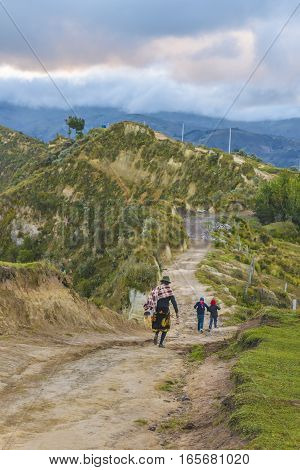 Andean Natives Walking At Road Quilotoa Ecuador