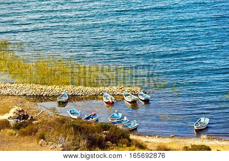 Twn small boats on the shore of Lake Titicaca on the Island of the Sun in Bolivia