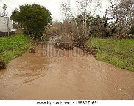The Guadalupe River in san Jose, california on Branham Lane and Almaden Expressway.This is after a heavy rain and the water is close to the banks.
