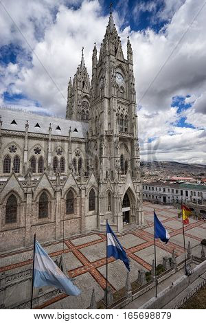 flags by the basilica de voto nacional Quito a neo-gothic style architecture