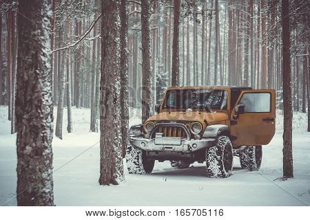 Karelian isthmus, Leningrad region, Russia - January 15, 2017. Jeep Wrangler unlimited on a forest road, the Wrangler is a compact SUV produced by Chrysler
