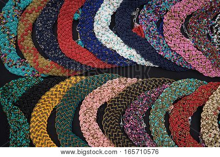 closeup of colourful microbead jewelry in Otavalo Ecuador artisan market
