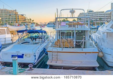 The quiet evening in port of Eilat with the beautiful view on the moored yachts Israel.