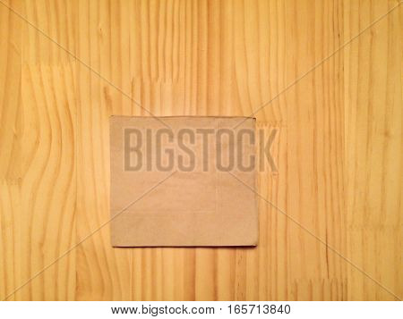 beige modern cocktail napkin on wooden table