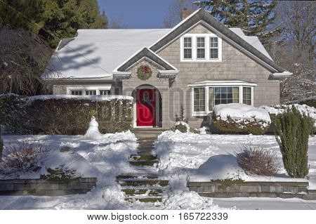 Family home and snow covered ground Gresham Oregon.
