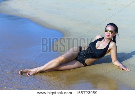 Lady show shape swimsuit in Ban Krut Beach at Prachuap Khirikhun Province Thailand