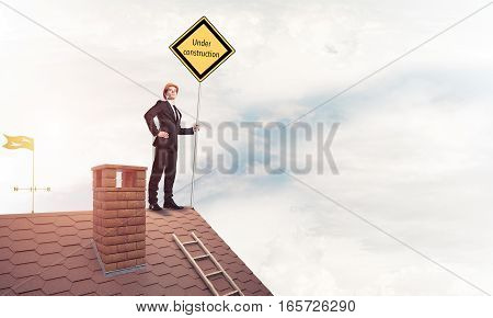 Man holding safety sign indicating under construction notice. Mixed media