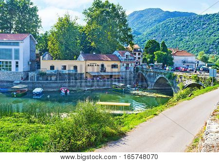The beautiful town of Virpazar with the tiny embankment occupied by cafes and restaurants Montenegro.