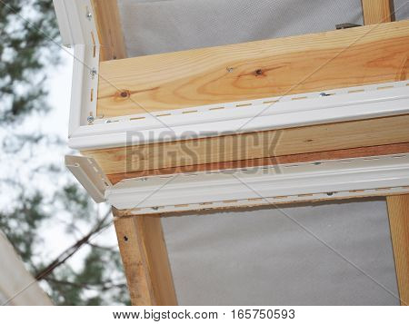 Install Soffit. Roofing Construction. Soffit and Fascia is Usually Constructed of Vinyl Wood or Aluminum and is Installed on the Underside of Roof Overhangs and Eaves.