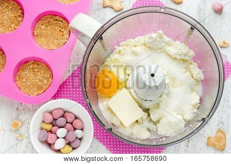 Easter nest cake cooking Easter recipe step by step preparation of Easter dessert mini cheesecakes with candy eggs
