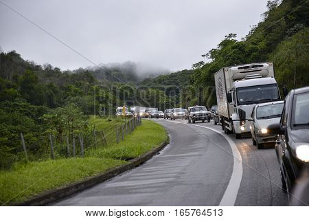 Rio de Janeiro Brazil - january 15 2017: Presidente Dutra Highway congested due to traffic in half lane near the Araras mountain range