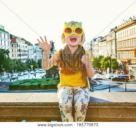 Happy Girl In Prague In Pineapple Sunglasses Handwaving