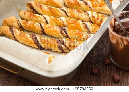 Homemade Cakes - Puff Pastry With Chocolate Paste. Twisted Cakes With Chocolate