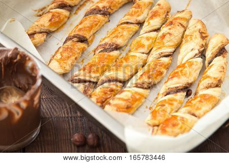 Homemade Cakes - Puff Pastry With Chocolate Paste. Twisted Cakes With Chocolate